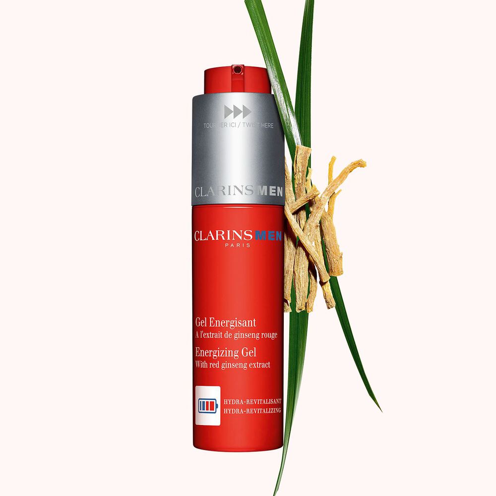 Packshot of the energizing gel for men next to some gymnema and bison grass to emphasize its key ingredient.