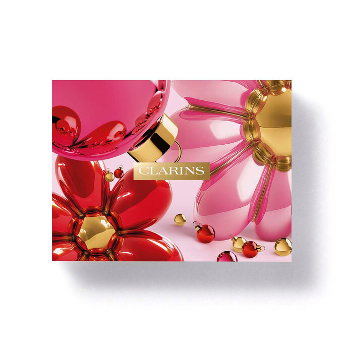 Clarins floral eco designed gift box packaging featuring bright spring flowers for a Christmas skincare gift set.
