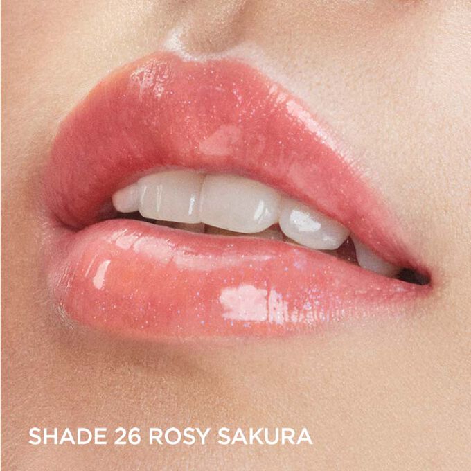 Focus on a woman's lips to show how lips look with Clarins Lip Comfort Oil in Rosy sakura, from the Fairy Blossoms range.