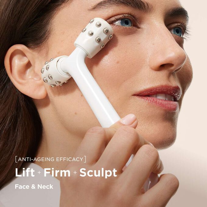Close up of a woman using myLIFTINGroller beauty tool to perform an expert face lift massage on her face