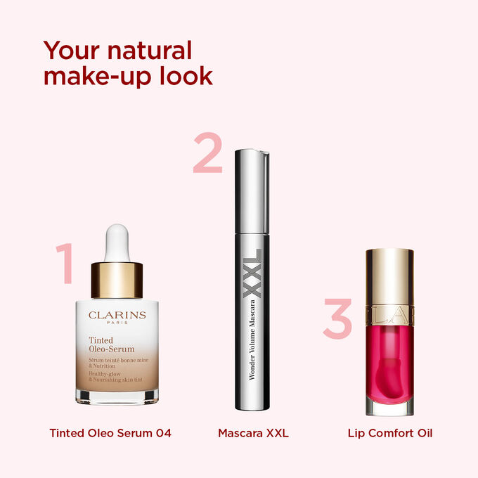 Clarins makeup selection for achieving a natural look, featuring a tinted serum, volumising mascara, and lip oil.