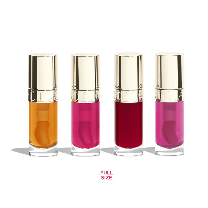 Photoshoot of the products in Clarins Lip Comfort Oil Gift set: 4 full-size Lip stains in orange, fushia, purple and pink.